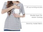 Woman breastfeeding in striped nursing top using lift-up access