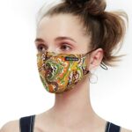 Green and orange paisley print cotton mask on a model