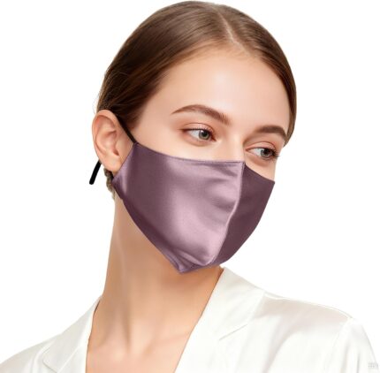 Model wearing a dark mauve silk face mask with black ear straps