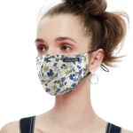 Cream mask with blue and yellow flower print on a model