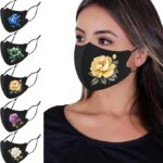 OMG Decor flower print ice silk face masks 5 pack in black with a yellow rose design on a model