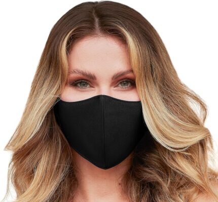 Woman wearing the Mask By Design washable face mask made in USA in solid black